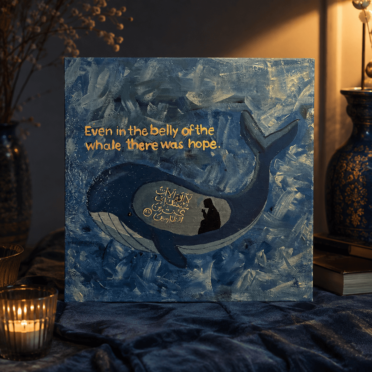 Textured blue painting featuring a whale with Prophet Yunus in prayer and gold Quranic calligraphy